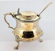 A Victorian silver mustard pot, with engraved motifs to lid hallmarked London 1899, together with