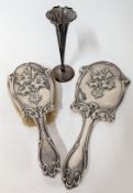 An Edwardian silver hairbrush and mirror with embossed floral decoration, hallmarked 1907 /