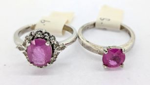 Gemporia, a pink sapphire set ring, set in silver together with a hot pink sapphire and white