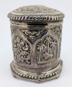An Indian silver jar with lid, decorated with embossed floral and animal scenes, unmarked, weight