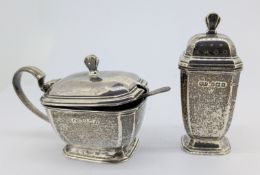 A silver mustard pot and pepper shaker, hallmarked Birmingham 1947/49, silver weight approx 2.7oz.