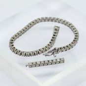 A diamond-set tennis bracelet, mounted in 14ct white gold, set with approximately 53 diamonds,