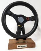 A Team Marlboro F1 McLaren steering wheel presented to former F1 journalist David Ray, by the