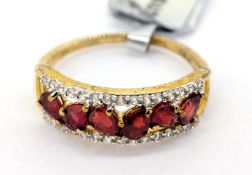 Gemporia, a Songea red sapphire and white zircon set ring, set in 9k yellow gold, size S, with