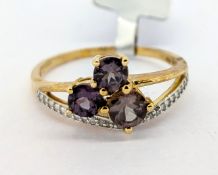 Gemporia, Arusha colour change garnet and diamond set ring, set in 9k yellow gold, size S, with