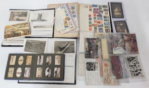 A collection of 20th century stamps, postcards, photographs, etc.