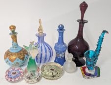 A collection of glass perfume bottles, together with paperweights, glass hanging candle holder in