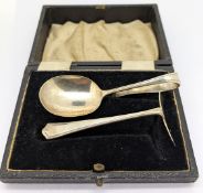 A George V silver baby spoon and pusher, hallmarked Sheffield 1935 with Jubilee mark, silver
