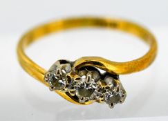 A trilogy crossover diamond ring, set in 18ct yellow gold, size Q, approx 3.1g.