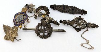 Five silver sweetheart brooches, together with a gilt example with enamel for 'The Royal British