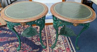 A pair of round pub tables by A. Reynolds & Co. Bar Fitters, Leeds, green painted metal base with