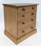 A miniature chest of drawers, approx 32cm x 30cm x 22cm.