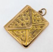A 9ct envelope pendant stamp holder, inscribed 'Sam from his Mother', approx 3.4g.