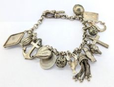 A silver charm bracelet with approx 15 charms, to include anchor, cat, heart, lobster, mermaid, etc.