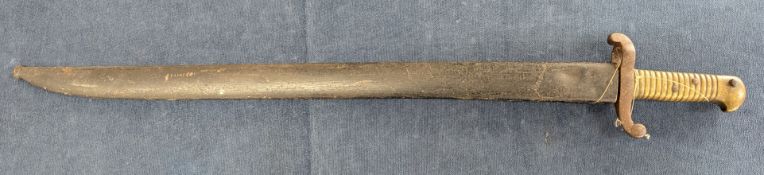 A 19th/20th century bayonet with scabbard, impressed marks to hilt '39', length approx 71cm.