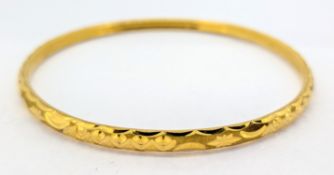 A 22ct gold bangle, approx 10.4g.