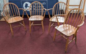 Ercol, a set of four Ercol 370 Carver chairs, of beech and elm. (4)