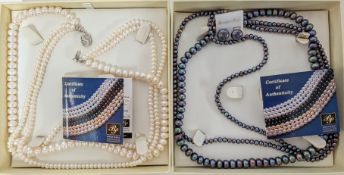 Two boxed Borneo fresh water pearls.