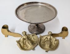 A pair of gilt painted seated geishas, together with a silver plated raised dish, and a pair of
