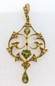 An Edwardian pendant, set with peridot and seed pearls, set in 15ct yellow gold, approx 3.8g.