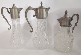 Three silver plated cut glass decanters. (3)