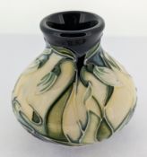 A Moorcroft Nivalis pattern miniature vase, marked to base 'c. 2002', height approx 6cm, boxed.