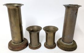 A pair of WWI naval shell casings, with curved rims, height approx 25.5cm, together with another