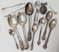 A collection of various silver flatware, to include teaspoons, sugar tongs, a dessert spoon