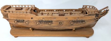An oak model of the hull of a sailing ship, length approx 85cm, with lion figurehead, carved