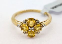 Gemporia, a Tanzanian Canary sapphire and white zircon set ring, set in 9k yellow gold, size S, with