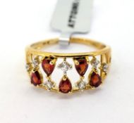 Gemporia, a Songea ruby and white zircon set ring, set in 9k yellow gold, size U, with certificate