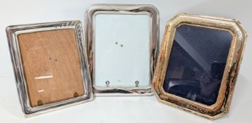 Three silver picture frames, largest approx 25cm x 20cm. (3)
