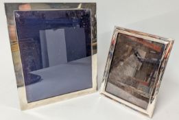 Two silver picture frames, approx 29cm x 24cm, 23cm x 18cm. (2)