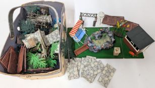 A collection of Britains Ltd. Garden pieces, to include birdhouse, bench, grass, pond, etc.