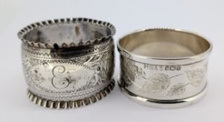 Two silver napkin rings with engraved foliate motifs, hallmarked Birmingham 1898, Sheffield