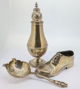 A silver sugar sifter and tea strainer, total weight approx 4.25oz, together with a silver shoe (