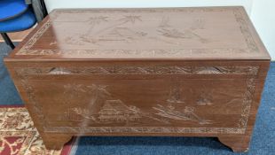 A carved Chinese chest, fitted compartment to interior, approx 91cm x 46cm x 50cm.