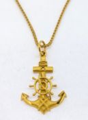 A gold ships anchor set on a 18ct gold chain, total weight approx 12.3g.