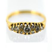 A 1970's 18ct gold nine stone diamond ring,
