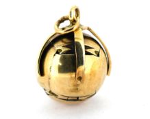 A 9ct gold Masonic ball fob, opens to reveal Masonic symbols, length approx. 1.5cm, 6.3grams.
