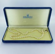 Mikimoto, a cultured pearl necklace, a string of knotted uniform cultured pearls, pearls approx. 6.