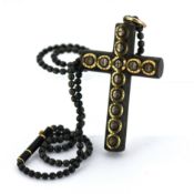An antique pique cross pendant with beaded chain, the cross pendant, (possibly wood), with bi-colour