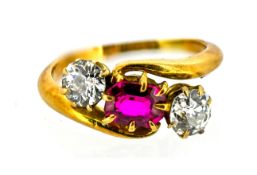 An antique 18ct gold ruby & diamond three stone ring