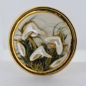 A 9ct gold studio pottery brooch, the handmade pottery disc depicting snowdrops, pin & safety catch,