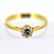 An 18ct gold diamond solitaire ring, claw set with a brilliant-cut diamond,