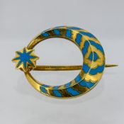 A Victorian enamel crescent moon and star brooch, decorated with turquoise coloured enamelling,