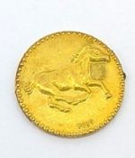 A Chinese zodiac coin, marked 999 featuring a galloping horse, 1g.