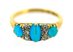 A turquoise and diamond ring, claw set with three oval-cut turquoise cabochons, each interspersed