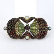 An antique bohemian garnet and pearl brooch, of Art Nouveau style,