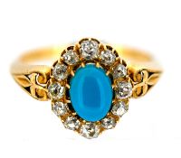 A Victorian turquoise and diamond cluster ring, claw set to the centre with an oval turquoise